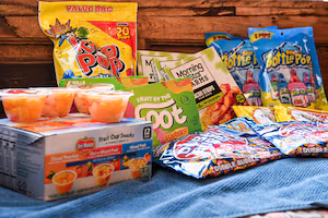 Bazooka Ring Pop Lollipops, Del Monte Fruit Cup Snacks, Starburst Fruit By The Foot snacks, Double Bubble Bubble gum, Vigo Saffron Yellow Rice, and Morning Star Farms Plant based bacon strips, all products that use Red Dye # 3, can be seen in this illustration photograph on December 27, 2024. The US Food and Drug Administration (FDA) on January 15, 2025 announced a ban on Red Dye No. 3, a controversial food coloring long known to cause cancer in animals, decades after scientific evidence first raised alarm. (Photo by ROBERTO SCHMIDT / AFP) (Photo by ROBERTO SCHMIDT/AFP via Getty Images)